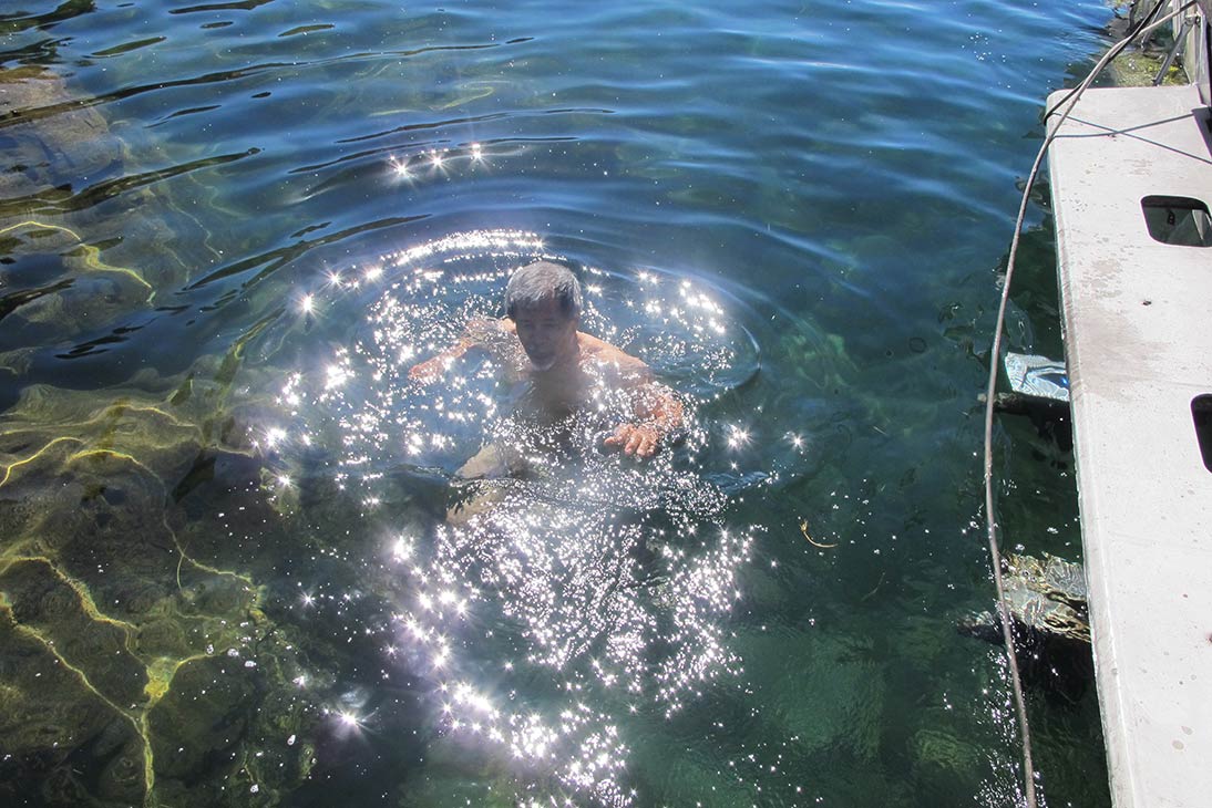 Peru, Lake Titicaca, Rene in the Water