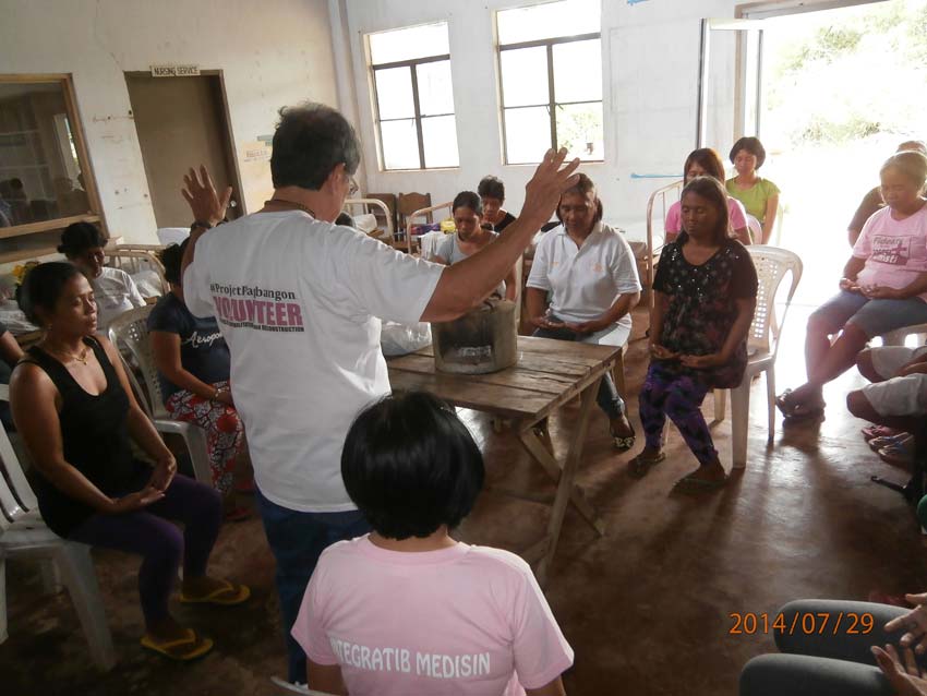 Connecting one's Qi to the energy of this group of women, survivors of the typhoon Haiyan. A part of the healing protocol of the Healing Tao.