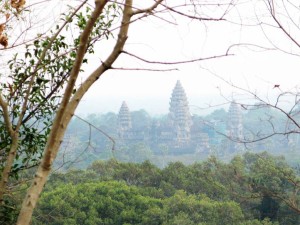 Angkor Wat Temple through trees