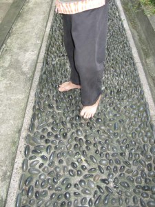 Man Barefoot on Stones