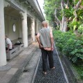 Man Walking Backward Barefoot on Stones