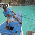 Boatman pulling rope