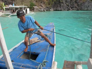 Boatman pulling rope